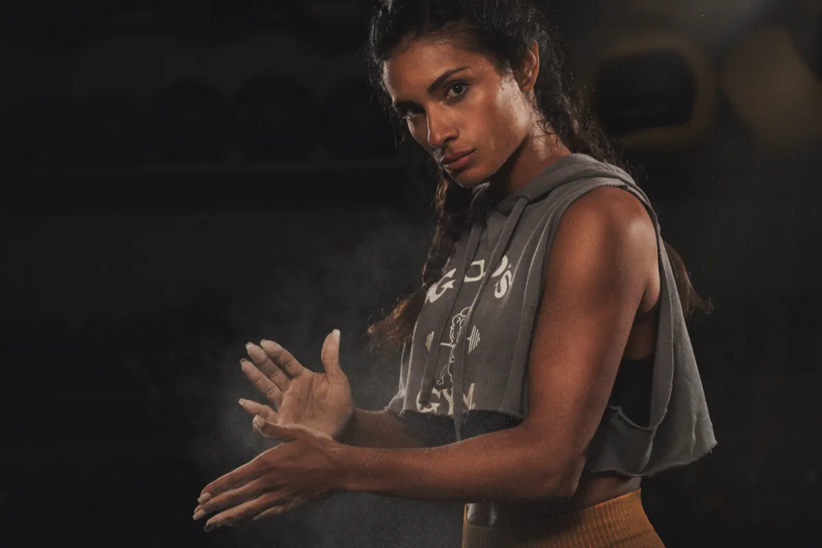 A member catching her breath after a workout at a Gold's Gym